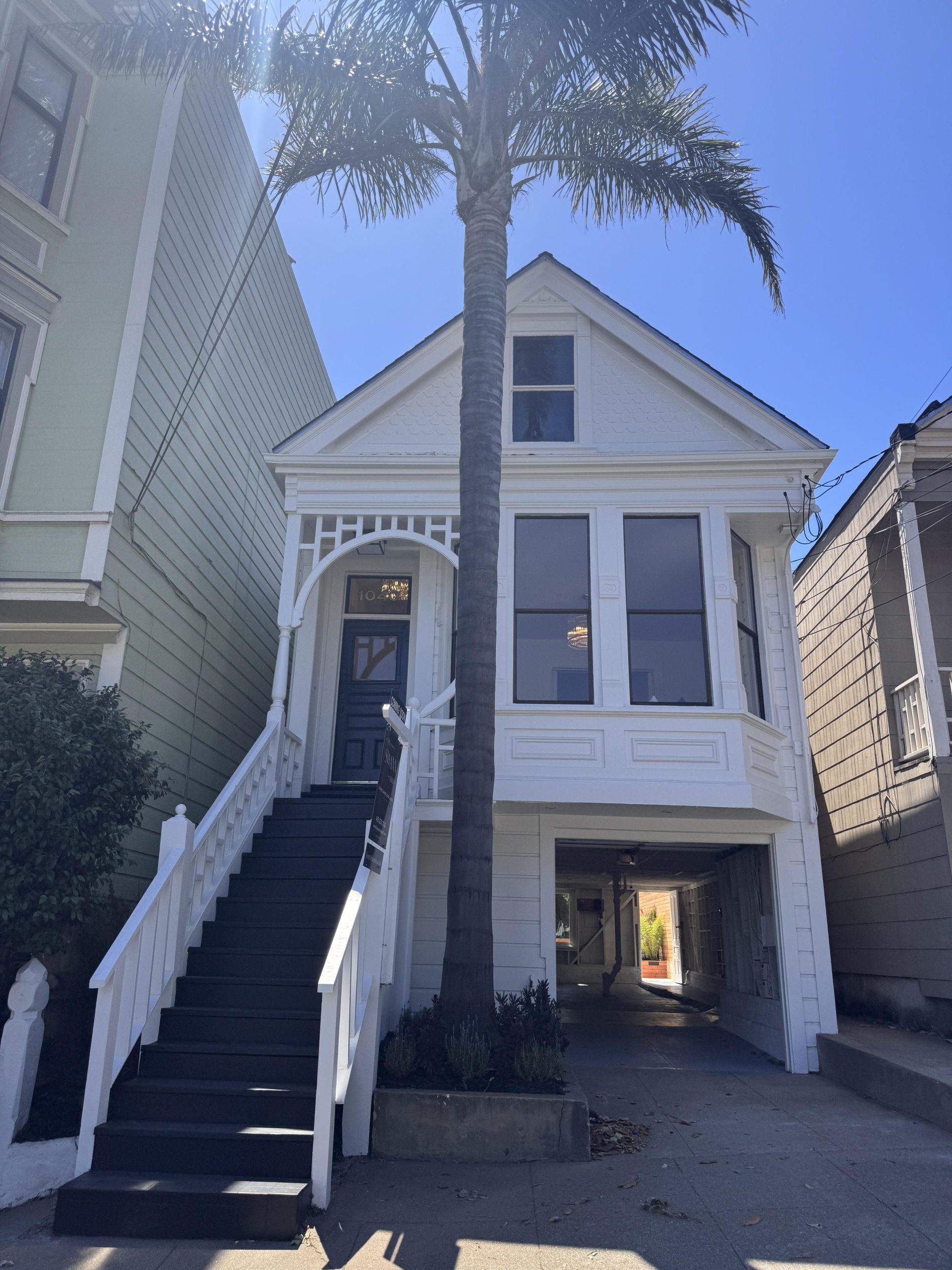 Sunny Victorian home with a palm tree in Noe Valley, San Francis